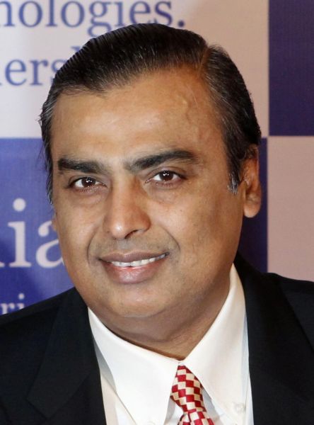 Mukesh Ambani, chairman of Reliance Industries Limited, poses for photographers before addressing the annual shareholders meeting.