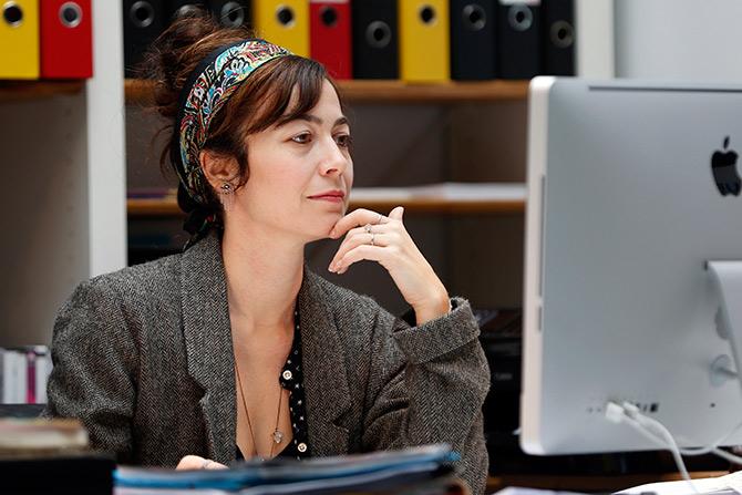 French filmmaker Eleonore Pourriat sits at a computer in Paris.