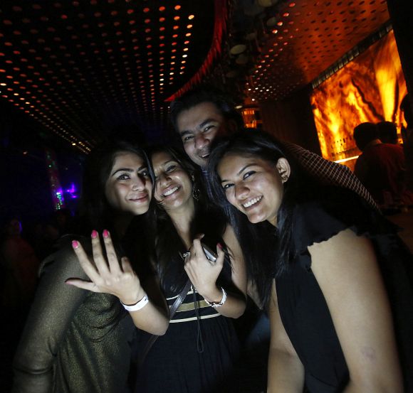 Malini Agarwal (C), blogger-in-chief of missmalini.com, poses for a picture with her friends at the Ren by China Garden nightclub in Mumbai.