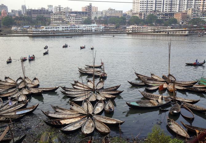 Boats are seen anchored by the river Buriganga, on the outskirts of Dhaka.