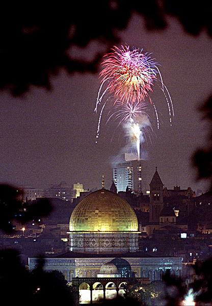 Fireworks set off from the roof of a Jerusalem hotel light up the sky over the Dome of the Rock in the Old City.