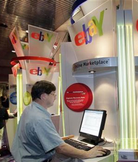A customer uses an eBay kiosk to check on an item he has for sale.
