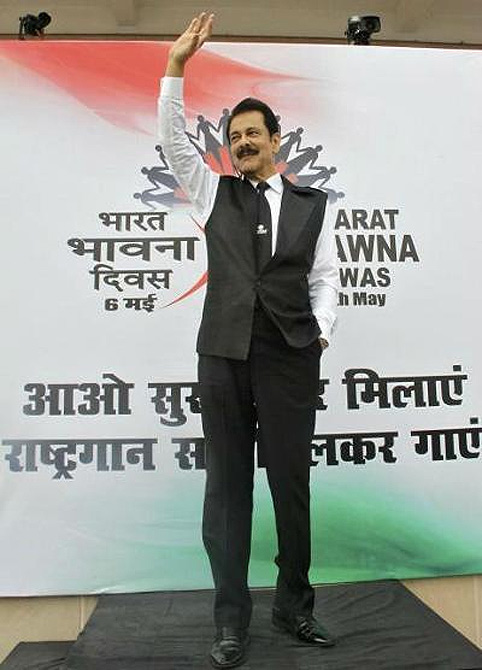 Sahara Group Chairman Subrata Roy waves at his employees before they sing the Indian national anthem in the northern Indian city of Lucknow.