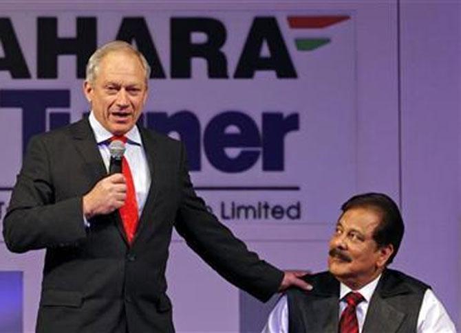 Sahara Group Chairman Subrata Roy (R) looks at Nicholas Billotti, chief executive officer of Turner Construction International.