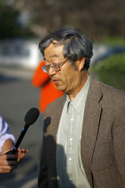 The man believed to be Bitcoin currency founder Satoshi Nakamoto talks to reporters.