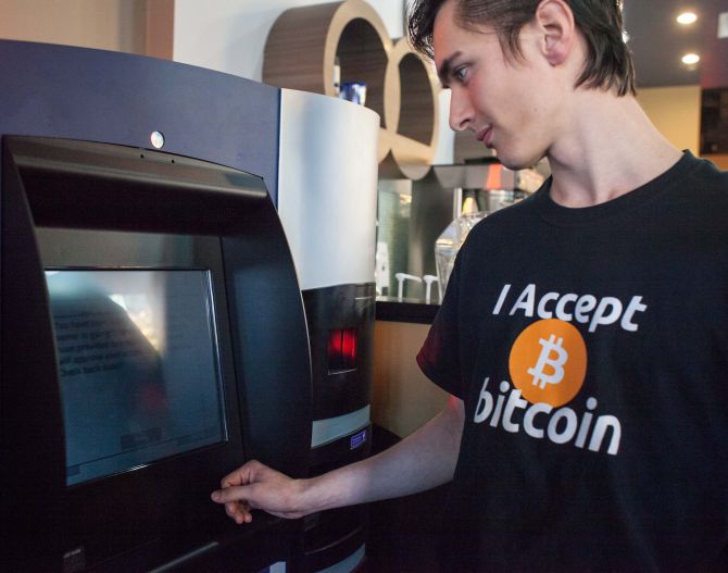 Gabriel Scheare uses the world's first bitcoin ATM.
