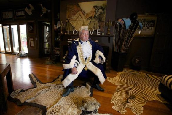 ewly elected Geelong Mayor, Darryn Lyons poses for a photograph in his mayoral robes in the living room of his home in Geelong.