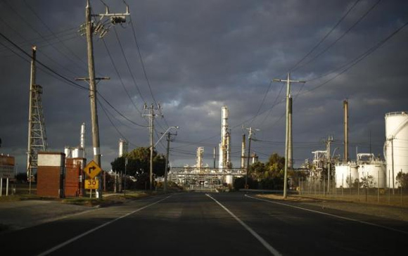 The road leading to the Shell Oil Refinery is seen at sunset in Geelong.