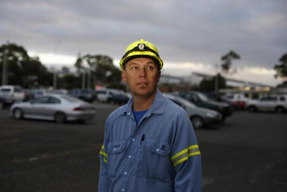 Alcoa aluminium smelter worker Adam Oates, 42, is pictured at his workplace in Point Henry.