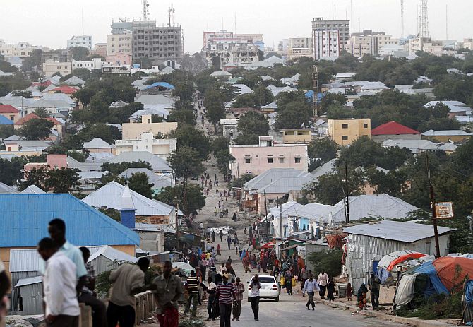 People walk along a street in Mogadishu.