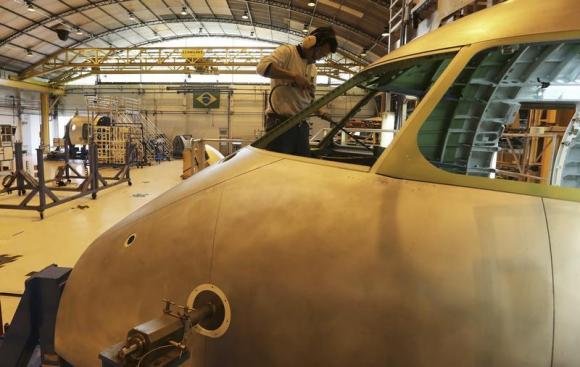 An employee works on the jet assembly line at the Embraer headquarters in Sao Jose dos Campos, 100 km from Sao Paulo May 14 2013.
