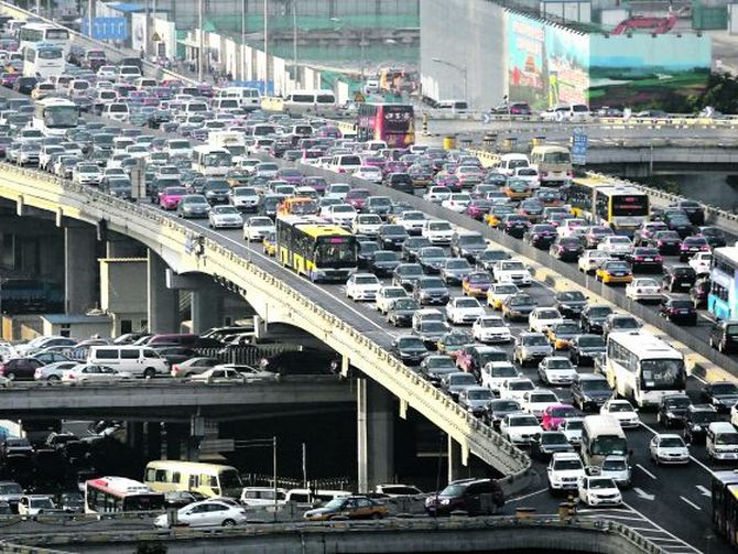 Rush-hour traffic in Beijing: As public dissatisfaction rises in China over the country's smoggy skies, cities such as Beijing and Tianjin have put limits on car purchases.