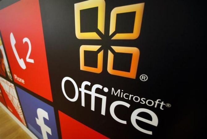 A Microsoft Office logo is shown on display at a Microsoft retail store in San Diego.