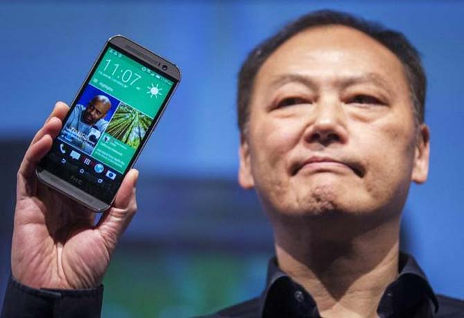 HTC CEO Peter Chou shows the new One M8 phone during a launch event in New York.