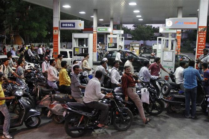 Bikers rush to fill petrol at a pump in Chandigarh.