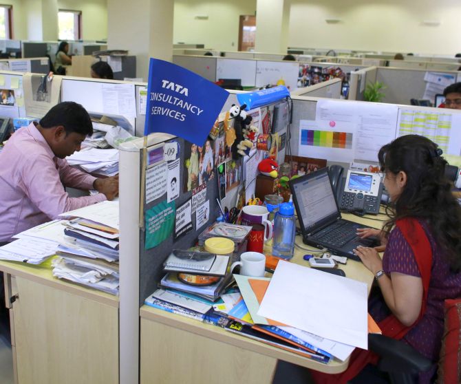 Employees work at TCS office.