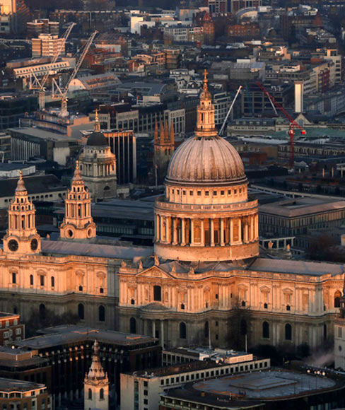 St Paul's cathedral is lit by the early morning sun in an aerial view taken from The View gallery at the Shard, western Europe's tallest building, in London.