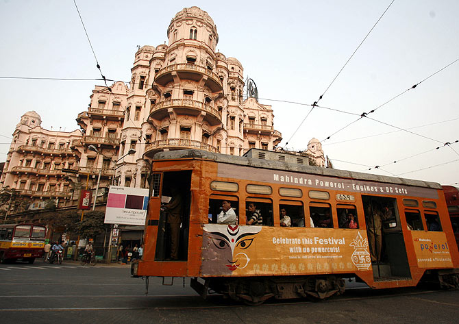 A tram passes beside a heritage building in the eastern Indian city of Kolkata.