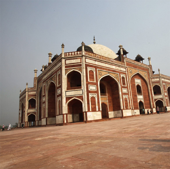 A tourist takes pictures of Humayun's Tomb in New Delhi.