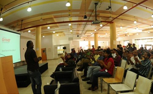 Employees of iGate during an event at the firm's auditorium.