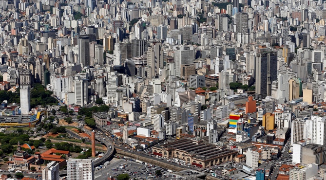 An aerial view shows downtown Sao Paulo, including Municipal Market.