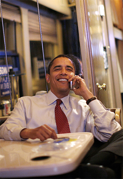 US President Barack Obama talks on the phone with his family during a campaign bus trip near Sioux City, Iowa.