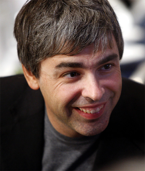 Google co-founder Larry Page speaks with people at his lunch table during the Clinton Global Initiative in New York.