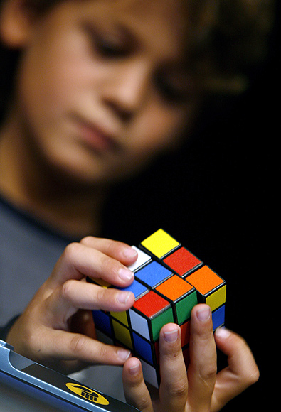 A young competitor attends the World Rubik's Cube Championship in Budapest.