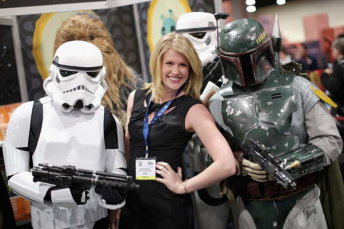 Kasey Darling of the Charles Koch Institute poses for photographs with people dressed as characters from Star Wars.