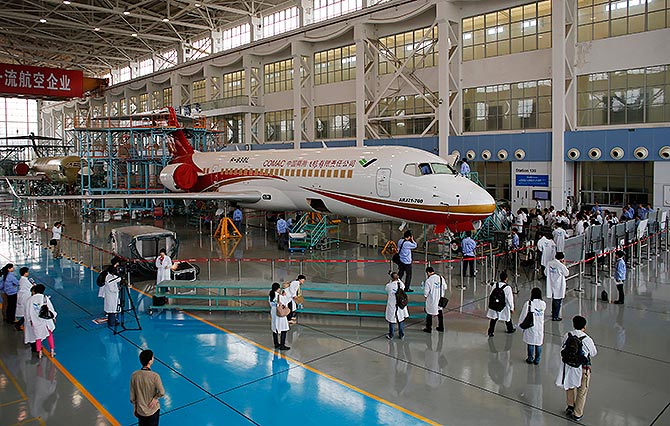 Members of the media visit a ARJ21-700 aircraft at its factory.