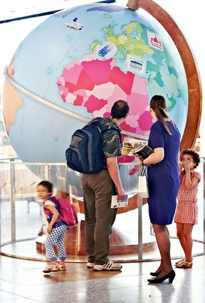 A family checks installation at the Heathrow Airport.