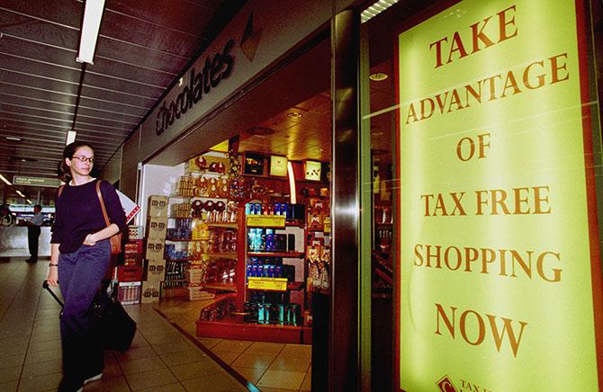 A woman looks at the goods on display inside a duty free shop at Schiphol airport Amsterdam.