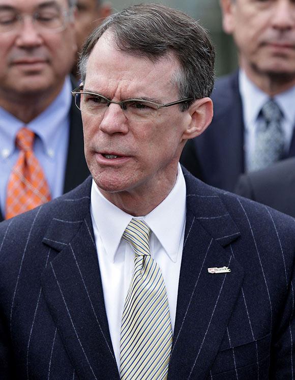 Richard Davis, CEO of Bancorp, talks to reporters after a meeting with U.S. President Barack Obama.