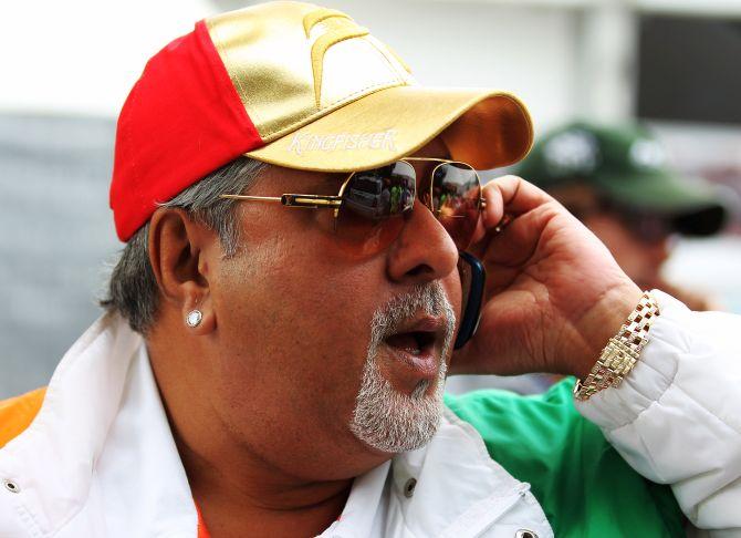 Vijay Mallya walks in the paddock during the Australian Formula One Grand Prix.