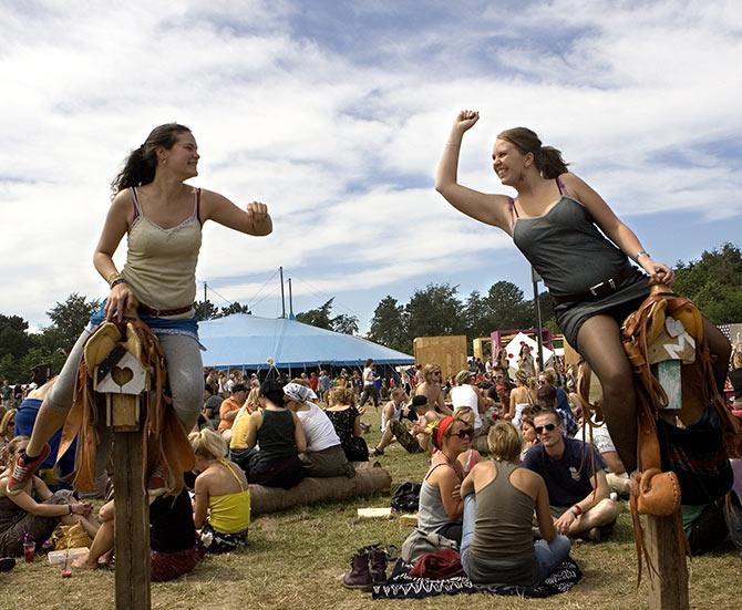 Fans attend the Roskilde Festival which features musicians Bob Dylan, Morrisey, Franz Ferdinand and Roger Waters.