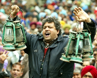 An employee of a state-run electricity board shouts anti-government slogans at a rally in Chandigarh.