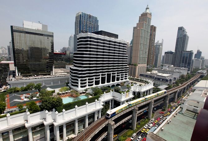 A skytrain passes over vehicles on the road in Bangkok April 4, 2013. 