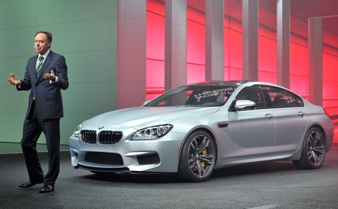 Dr Ian Robertson, of the BMW Board of Management, speaks next to the M6 Series Gran Coupe at the North American International Auto Show in Detroit, Michigan.
