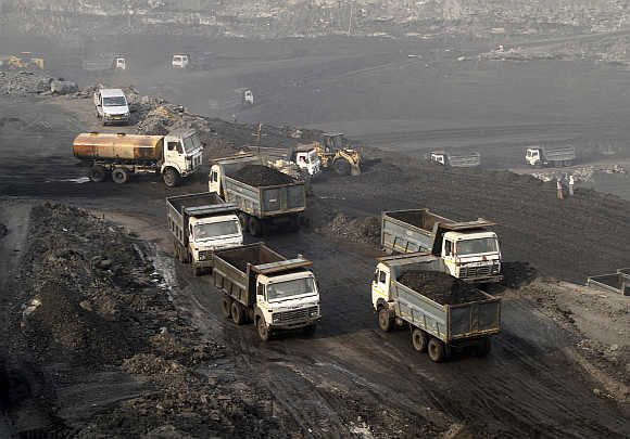 Trucks move in the Mahanadi coal fields, near Talcher town, in Orissa.