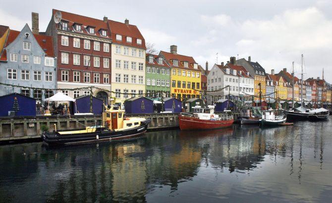 Boats are seen anchored at the 17th century Nyhavn district, home to many shops and restaurants in Copenhagen. 