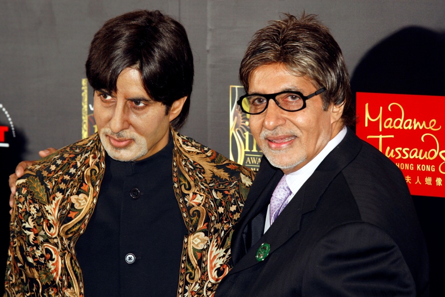Amitabh Bachchan poses with his wax figure after he arrived for the Zaia Cirque Du Soleil Show during the 10th International Indian Film Academy (IIFA) weekend in Macau June 11, 2009. 
