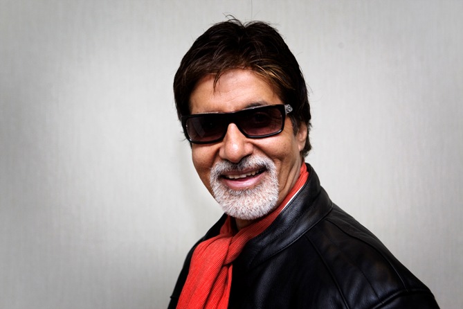 Amitabh Bachchan poses after talking to the media to promote the 'Unforgettable' world tour in Toronto.