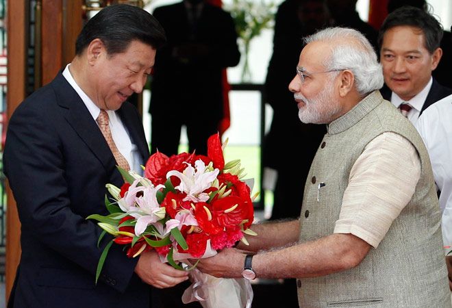 Prime Minister Narendra Modi greets Chinese President Xi Jinping, September 2014. Photograph: Press Information Bureau