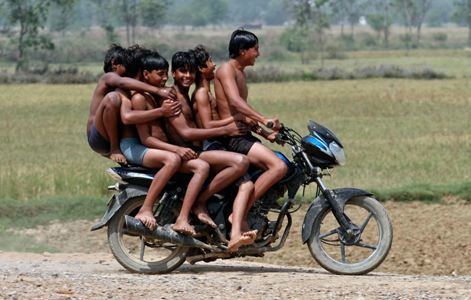 Boys on a motorbike ride back home after they had a bath at the Chachura village canal, in Uttar Pradesh. Parivartan Sharma/Reuters