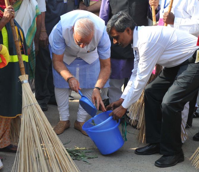 Prime Minister Narendra Modi launching the cleanliness drive for Swacch Bharat Mission from Valmiki Basti in New Delhi.