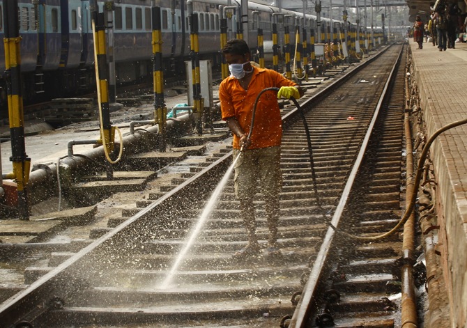 A worker cleans a railway track at a railway station in Kolkata. Rupak De Chowdhuri/Reuters