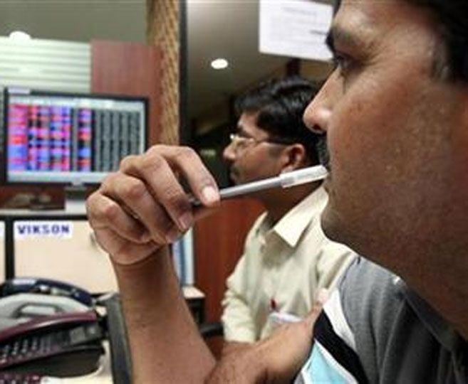 Traders work at a stock exchange.