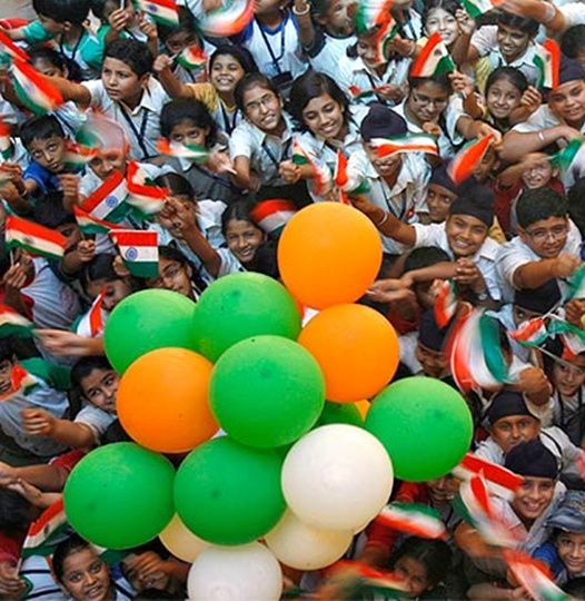 Students wave national flags in Chandigarh.