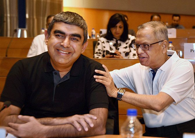 Infosys Executive Chairman N R Narayana Murthy with CEO & MD Vishal Sikka at a press conference at Infosys headquarters in Bengaluru