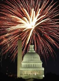 Fireworks explode over the United States Capitol dome and Washington Monument on Independence Day.